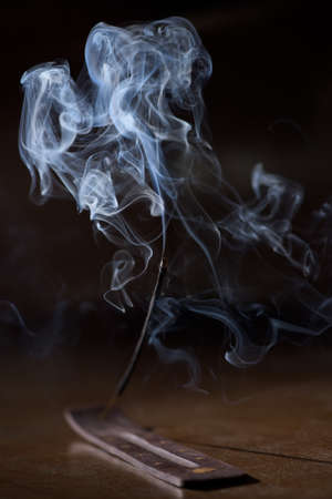 simble incense stick smolders and creates smoke and smellの写真素材