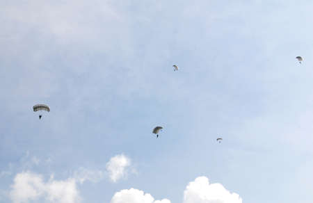 Group of parachutes against a blue skyの写真素材