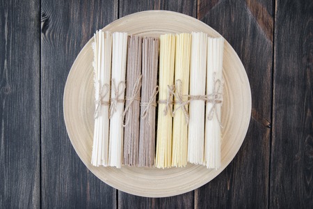 Japanese vermicellifine noodles on an old wooden table, rustic style