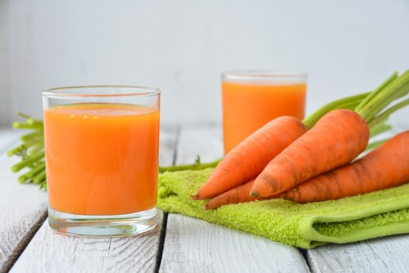 Two glasses of fresh carrot juiceの写真素材