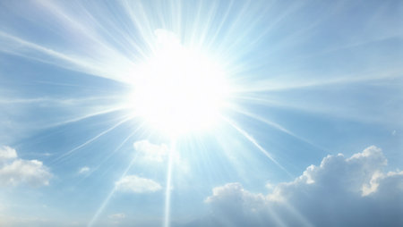Bright sunbeams in the sky background. Minimal nature, summer, seasonal concept. Abstract product placement idea. Copy space.の素材