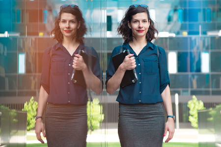 attractive young businesswoman posing with a tabletの写真素材