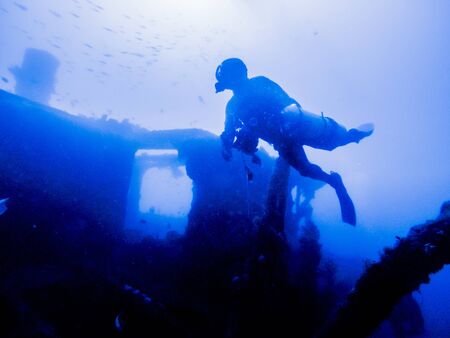 Women who enjoy diving in the clean seaの写真素材