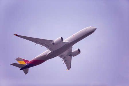 Airplane taking off from Fukuoka Airport in Japanのeditorial素材