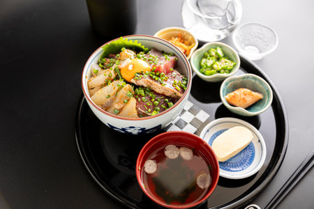 Photographing Japanese seafood bowl at the dining tableの写真素材
