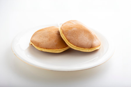 pancakes on a white plate on a white background closeupの写真素材