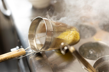 Coffee being brewed in a sieve