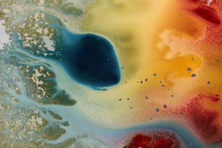 Abstract hand drawn watercolor background, stain watercolors colors between wet glasses. Used macro lens.の写真素材