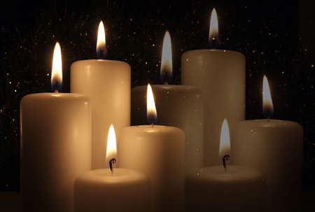 Candles Burning at Night on the dark background. Double exposure.の写真素材