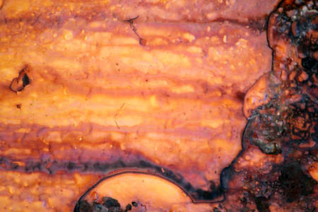 Old iron rusty mooring bollard's fragment at a harbor.の写真素材