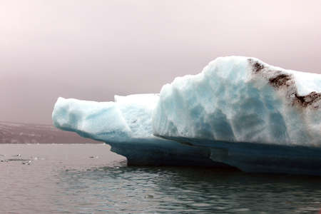 Jokulsarlon, Iceland - mid summer. Melting icebergs from Vatnajokull glacier floating in Jokulsarlon lagoon.の写真素材