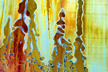 Abstract hand drawn watercolor background, stain watercolors colors between wet glasses. Used macro lens.の写真素材