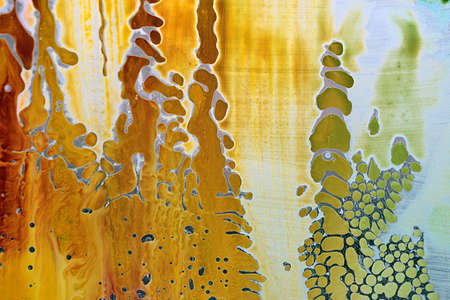 Abstract hand drawn watercolor background, stain watercolors colors between wet glasses. Used macro lens.の写真素材