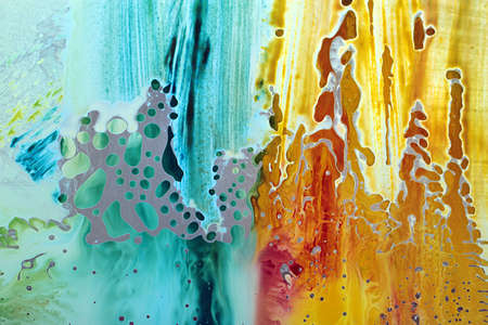 Abstract hand drawn watercolor background, stain watercolors colors between wet glasses. Used macro lens.の写真素材