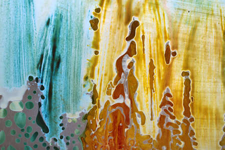 Abstract hand drawn watercolor background, stain watercolors colors between wet glasses. Used macro lens.の写真素材