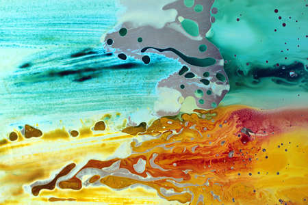Abstract hand drawn watercolor background, stain watercolors colors between wet glasses. Used macro lens.の写真素材