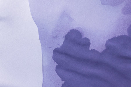Wet stained paper background. Purple paper texture with water stains. Grunge background or texture.の写真素材