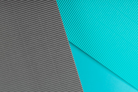 Blue and gray corrugated paper texture. Geometric shapes and lines. Minimalist background. Flat lay. Copy space.の写真素材