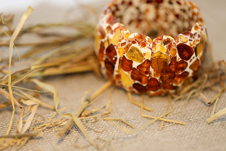 Natural polished amber bracelet on a linen napkin. Focus ahead. Close up.の写真素材