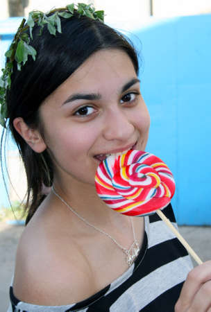 Teenage girl with lollipopの写真素材