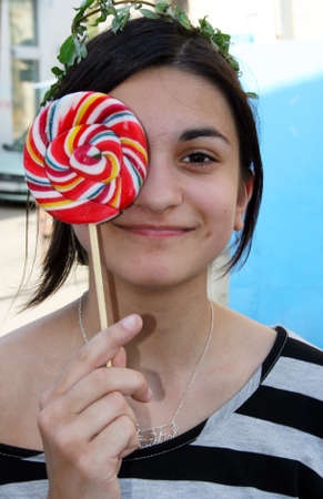 Teenage girl with lollipopの写真素材