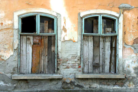 Boarded windows on an old house の写真素材