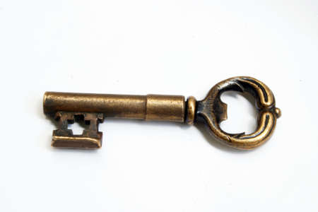 Beautiful golden key at the white backgroundの写真素材