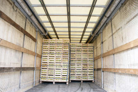 Storage space in a truck full of applesの写真素材