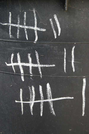 Tally marks or hash marks, a unary numeral system.