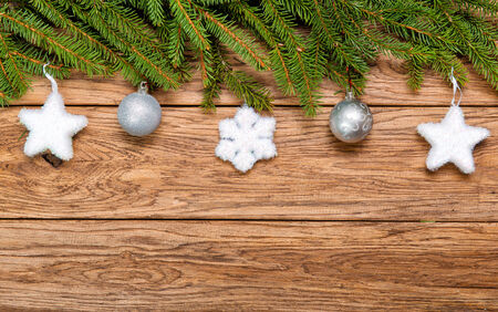 Decorated Christmas fir tree on a wooden boardの写真素材