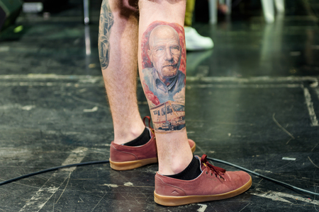 MINSK, BELARUS - SEPTEMBER 19, 2015: People show their tattoos for judging. The 2th International Tattoo Conventionのeditorial素材