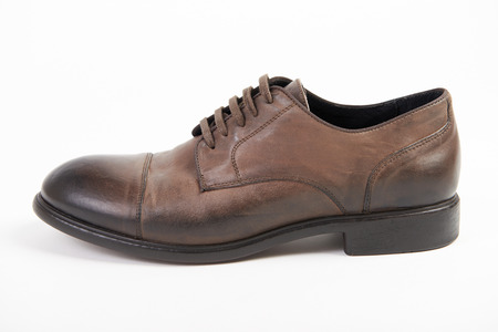 Man's brown natural leather shoes on white background isolated, comfortable footwear.の写真素材