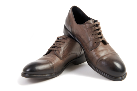 Man's brown natural leather shoes on white background isolated, comfortable footwear.の写真素材