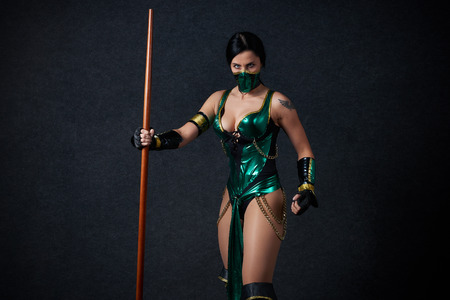 MINSK, BELARUS - NOVEMBER 03, 2018: Uni?on Convention & Game Expo Minsk 2018. Cosplayer Mortal Kombat Jade Kitana shoot on black background in photo zoneのeditorial素材