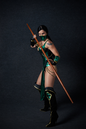 MINSK, BELARUS - NOVEMBER 03, 2018: UniÐ¡on Convention & Game Expo Minsk 2018. Cosplayer Mortal Kombat Jade Kitana shoot on black background in photo zoneのeditorial素材
