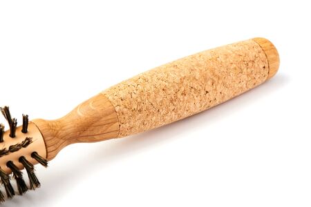 New modern wooden hairbrush isolated on white background.の写真素材