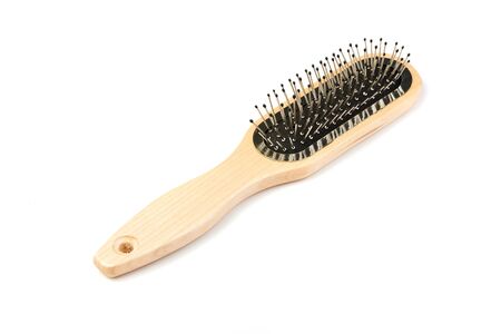 New modern wooden hairbrush isolated on white background.の写真素材