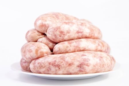 Raw Sausages, Oktoberfest Sausages close-up, isolated on white background. Raw meatの写真素材