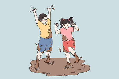 Happy small kids play jump in dirty puddleのイラスト素材
