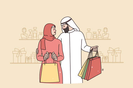 Rich Arabic couple with bags shopping in mallのイラスト素材