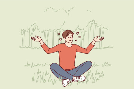 Young guy sits in lotus position on lawn doing yoga and meditating to restore strengthのイラスト素材