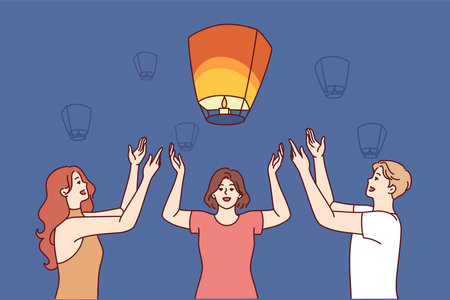 Friends launch chinese air lanterns together to make wish during festive night festivalのイラスト素材