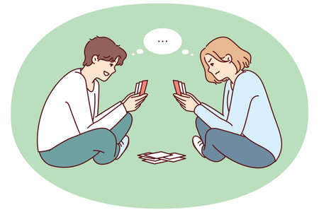 Young man and woman play cards sitting on floor and think what next move to makeのイラスト素材