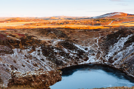 Top view of the Kerid crater with blue lake at sunrise. The Golden Circle tour. Iceland landscape.の写真素材