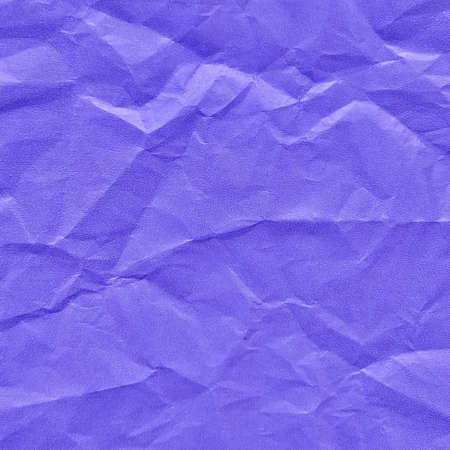 Realistic crumpled blue paper texture backgroundの写真素材