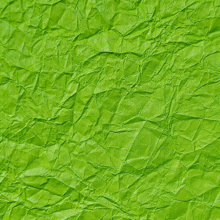 Realistic crumpled green paper texture backgroundの写真素材