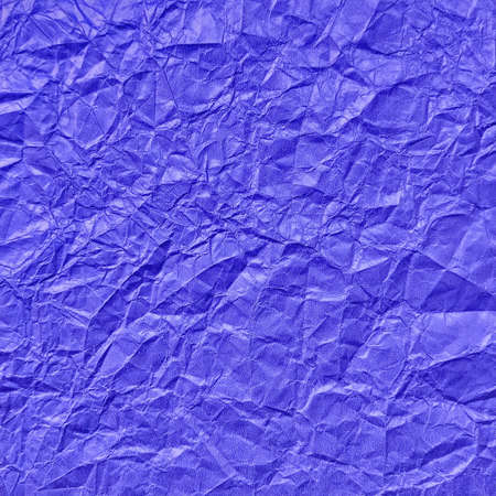 Realistic crumpled blue paper texture backgroundの写真素材