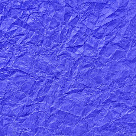 Realistic crumpled blue paper texture backgroundの写真素材