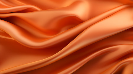 Close up of a soft satin texture in orange colors. Elegant background.の素材