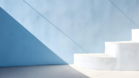 Empty room in blue colors with shadows on the wall. Elegant Studio Background for Product Presentation.の素材